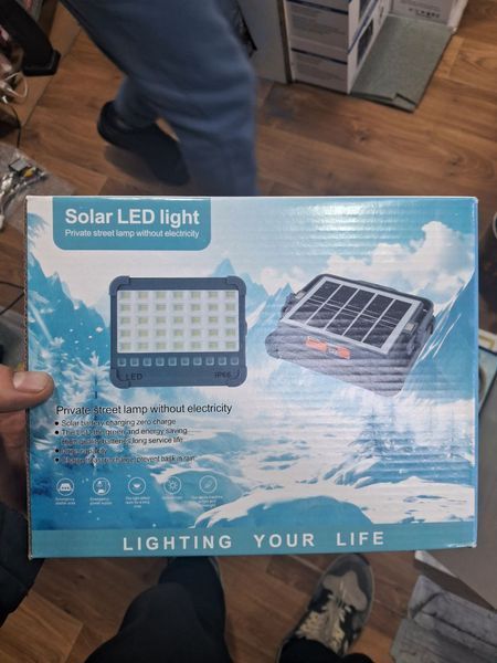 Потужний ліхтар - прожектор із сонячною панеллю та функцією Power bank Solar LED light 12000 mAH 4407003 фото