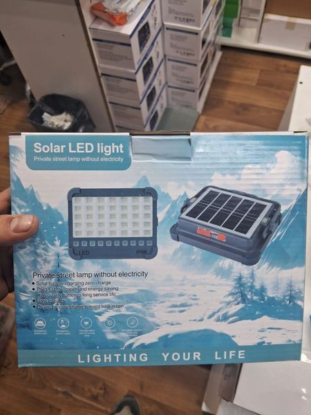 Потужний ліхтар - прожектор із сонячною панеллю та функцією Power bank Solar LED light 12000 mAH 4407003 фото